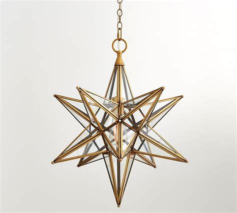 Star is a lampshade collection made of polished brass. Glass Star Pendant | Pottery Barn