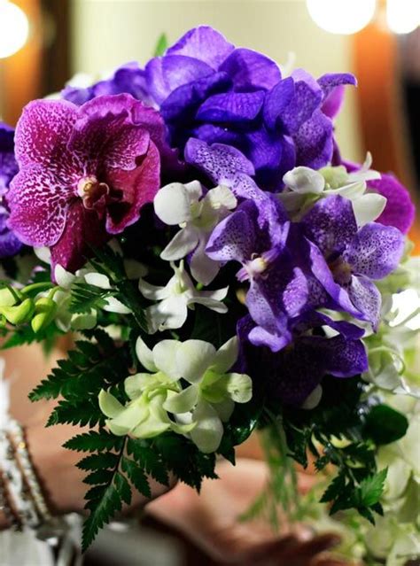 Oval Pink And Purple Vanda Orchids With White Thai Orchids And Fern