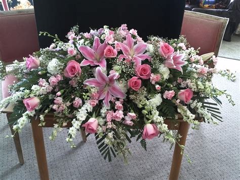 Once the casket saddle is positioned, you can adjust the flowers as needed. Funeral Flowers & Sympathy Flowers - Send Flowers for ...