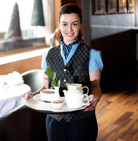 Pretty Waitress Posing With Tea For Guests Stock Photos Image 26891163