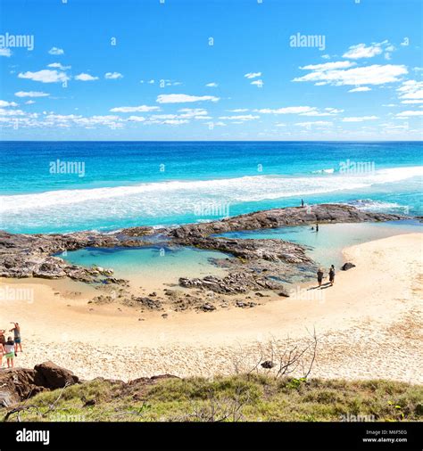 In Australia Fraser Island The Beach Near The Rocks In The Wave Of