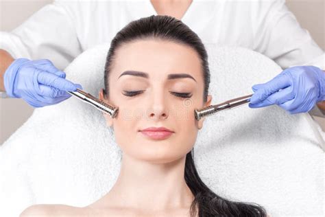 The Cosmetologist Makes The Procedure Microdermabrasion Of The Face