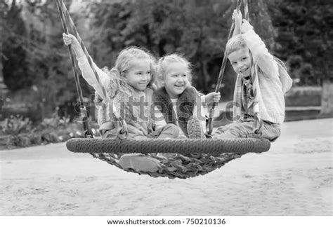 Three Children Playing Park Swing Black Stock Photo 750210136