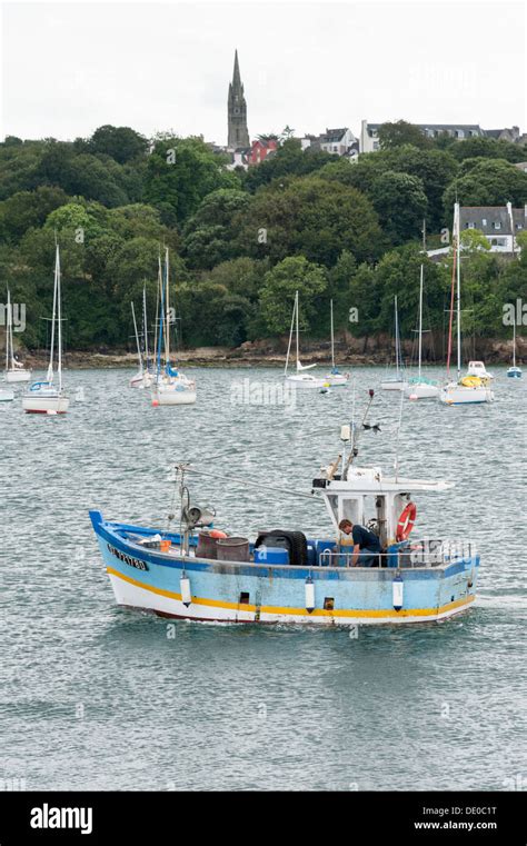 A Commercial Fishing Boat Leaving The Harbour At Douarnenez Brittany