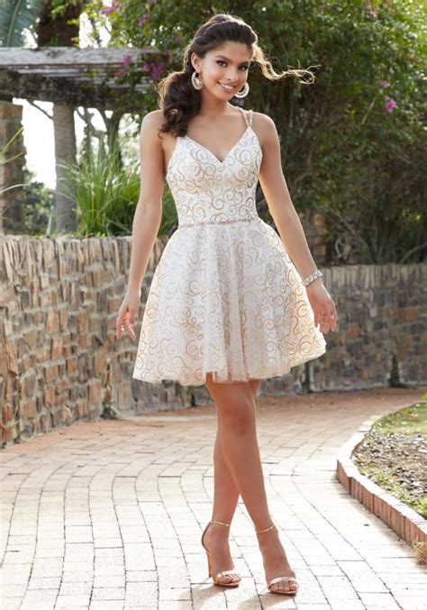 Here is another prepossessing dama hairstyle for quinceaneras that will give your hair a new look. Floral Printed Larissa Satin Cocktail Dress with Beaded ...