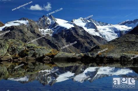 Mountain Scenery Reflected In Glacial Lake Gran Paradiso National Park Italy Europe Stock