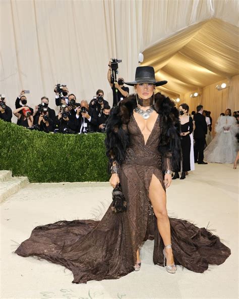 Jennifer Lopez Wears A Plunging Feathered Ralph Lauren Gown At The 2021 Met Gala