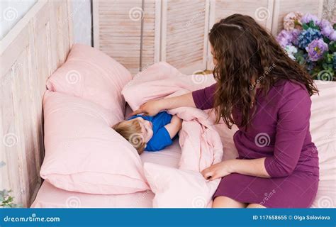 Mum Puts To Bed A Son Mother Putting Son To Bed Stock Image Image Of Comfortable Beautiful