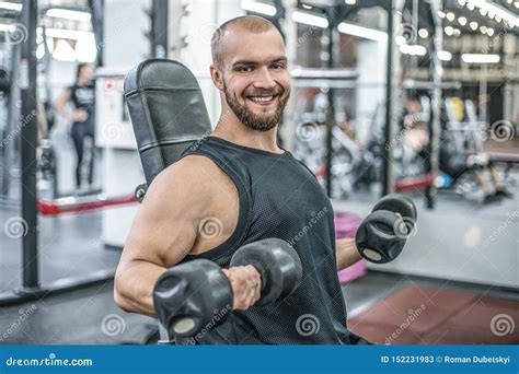 Bodybuilder Hard Training In The Gym Stock Photo