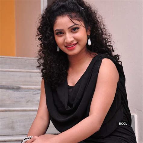 Vishnu Priya Sizzles In A Black Dress While She Poses During A Photoshoot