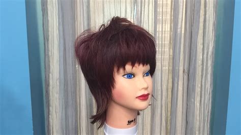 This haircut is an updated and more edgy look than the previous versions of the mullet which were popular in the 80's. Modern Mullet Haircut for Women - How to cut - Step by ...