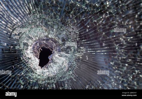 Bullet Hole In Glass With Cracks Real Bullet Hole Close Up Authentic