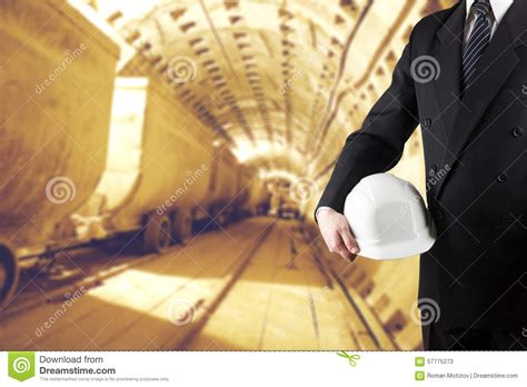 Close Up Of Engineer Hand Holding White Safety Helmet For Worker Stock