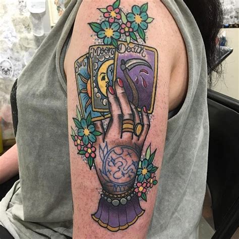The most common tarot card tattoo material is metal. Hand holding tarot cards tattoo - Tattoogrid.net
