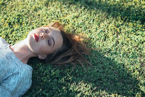 Young Woman Laying On Grass Del Colaborador De Stocksy Vera Lair Stocksy