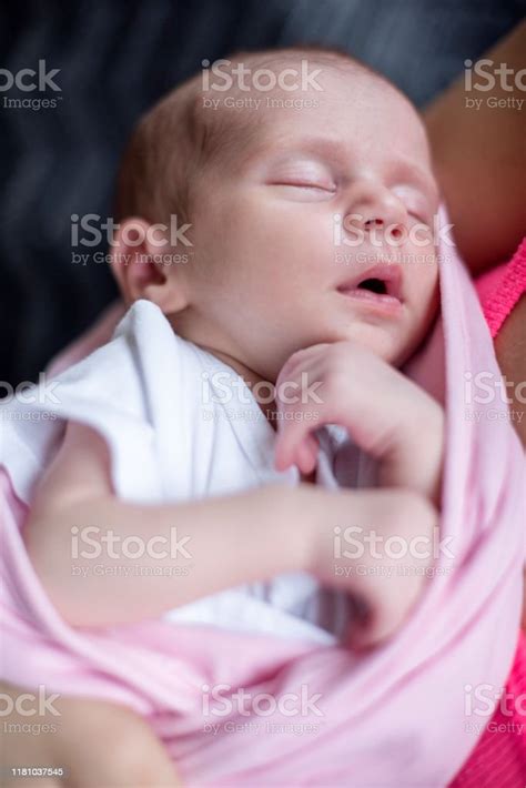 The Infant Sleeps In His Mothers Arms Stock Photo Download Image Now