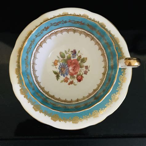 Aynsley Tea Cup And Saucer Turquoise Blue Floral Center Pattern Fine Bone China England