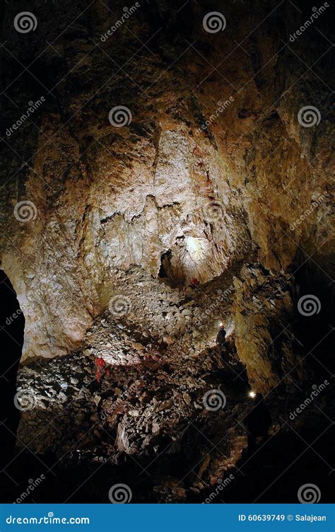 Spelunkers In A Gigantic Cave Stock Image Image Of Darkness Geologic