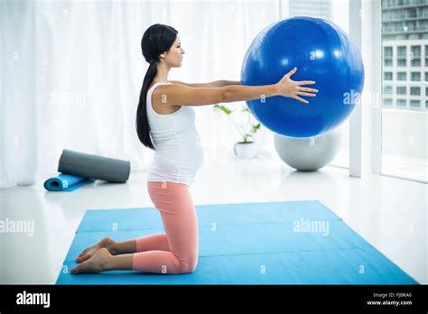 Pregnant Woman Exercising With Exercise Ball Stock Photo Alamy