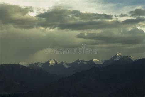 A Light From The Sunset On The Snowy Mountain Tops Stock Image Image