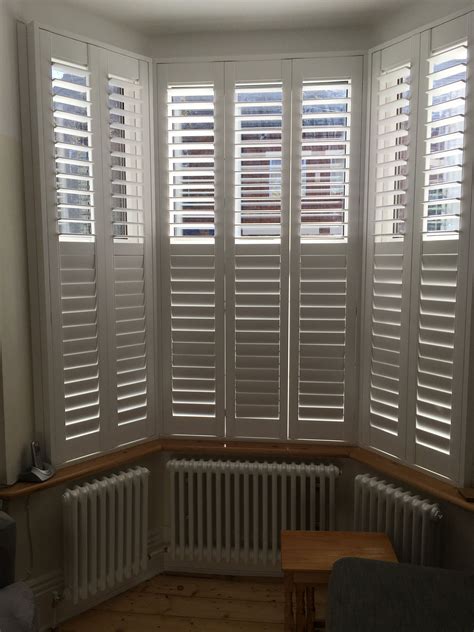 Complete restoration of the façade included new custom windows with colored glass and new entry stairs. Bay window shutters | Front rooms, Lounge decor, Front room