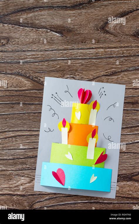 Greeting Card With Birthday Cake Congratulation On A Wooden Table