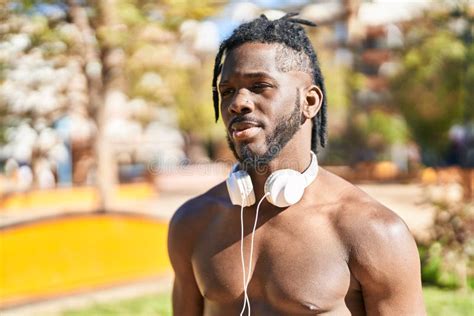 African American Woman Shirtless Standing With Serious Expression At