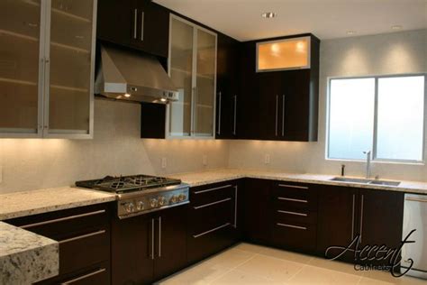Ribbon mahogany veneer is also known as ribbon striped mahogany wood veneer. Ribbon/Sapele mahogany Contemporary kitchen, with aluminum framed glass cabinet accents ...