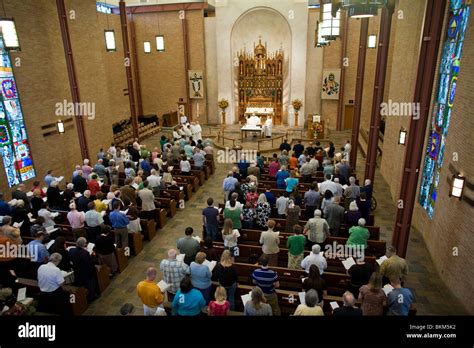 Congregation Stands To Sing Hymn During Service At St Martins