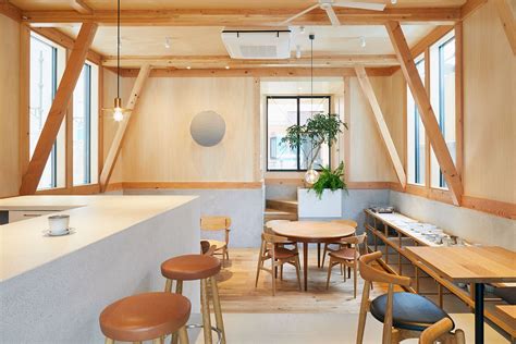 Modern Japanese Café With A Cozy Residence Above Makes A Woodsy
