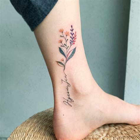 Flowers are one of the most beautiful things the universe has created. Flower and name ankle tattoo - Tattoogrid.net
