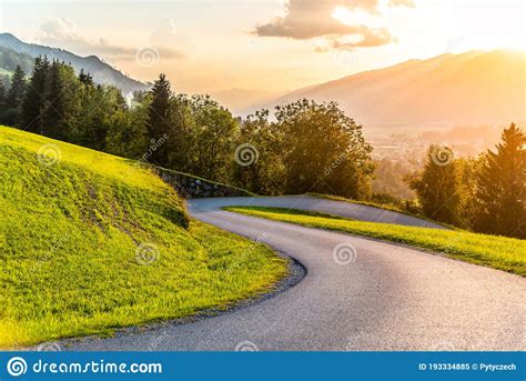 Romantic Sunset In The Mountains Alpine Rural Curvy Road Green