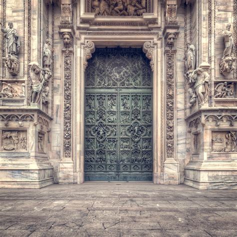 Il Duomo's Main Door in Milan, Italy - Battered ...