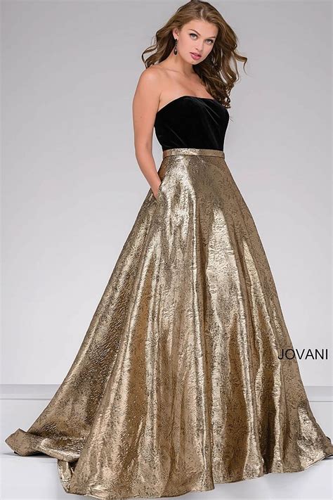 Floor Length Black And Gold Strapless Ballgown Features A Velvet Bodice