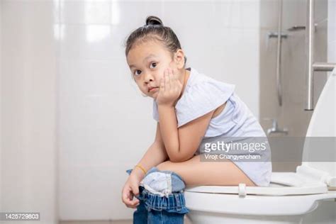 Girl Peeing On Toilet Photos And Premium High Res Pictures Getty Images