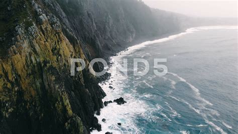 Aerial Fly Over Pacific Ocean Crashing Into The Northwest Coastline Or