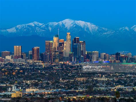 Los Angeles Skyline With Snow Capped Mountains High Res Stock Photo