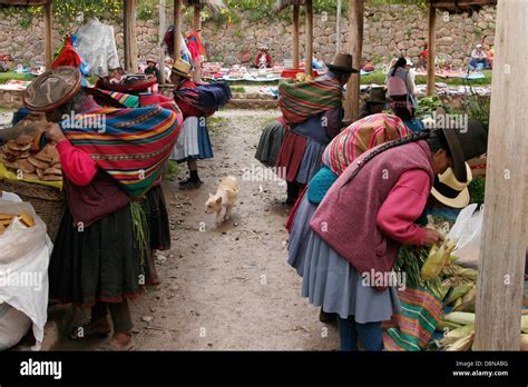 Quechua Women On Traditional Indigenous Sunday Market In Chinchero Near