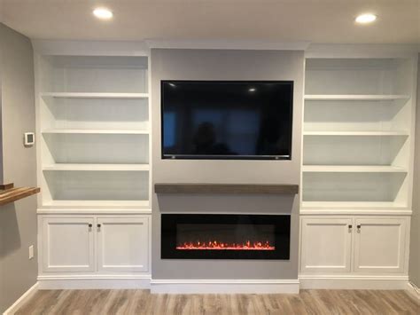 A wall mount electric fireplace is a simple addition to just about any home, and it is a lot easier to install than a conventional recessed fireplace. Pin by Paz Thomas on Built ins | Built in shelves living ...