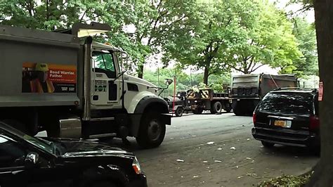 Nyc Dot Dump Trucks Carrying Asphalt Wait To Be Put To Use During Re