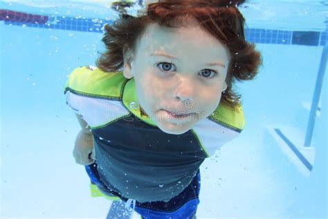 Child Swimming In Pool Underwater Stock Photo Image Of Swimwear