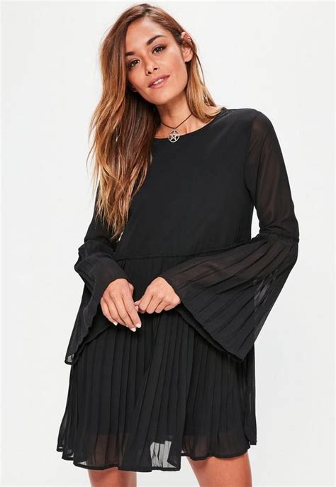 Cute and always trendy, long sleeves keep you comfortable so you can focus on having fun. Black Long Sleeve Pleated Swing Dress | Missguided