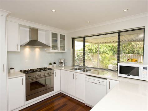 It is also very efficient and functional. Modern u-shaped kitchen design using stainless steel ...