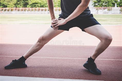 Young Fitness Athlete Man Running On Road Track Exercise Workout