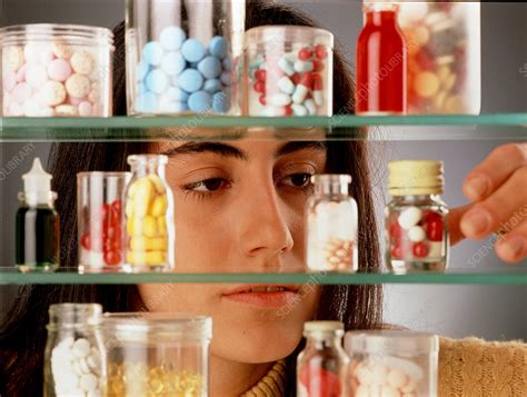 Perkins would have been famous simply by being the first woman cabinet member, but her legacy also stems from her additional accomplishments. Young woman takes pills from a medicine cabinet - Stock ...