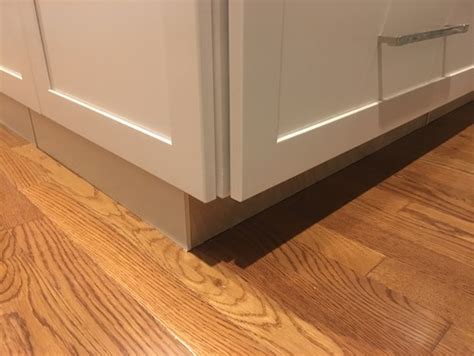 Cabinet toe kick installation to a floor that is at least an inch off. How did you handle your island toe kick/base molding?