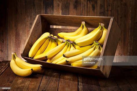 Bananas In A Crate On Rustic Wood Table High Res Stock Photo Getty Images