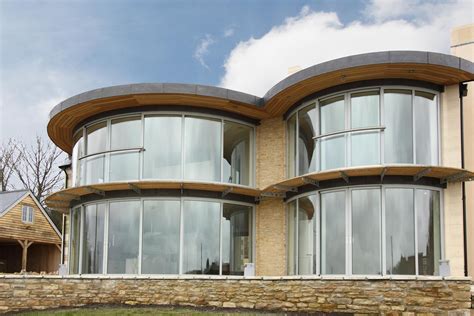 Stunning Curved Glass Doors For Private Patios And Public Buildings