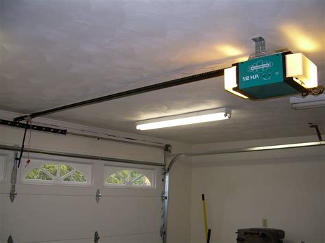 Before you begin installing a remote garage door opener, raise and lower the door to make sure it is correctly balanced and rolls freely. Low Profile Garage Door Opener - HomesFeed