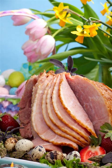 easter ham honey ham on easter table with quail eggs tulips and decoration ad honey